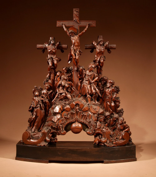 A magnificent carved pear wood group of the Crucifixion